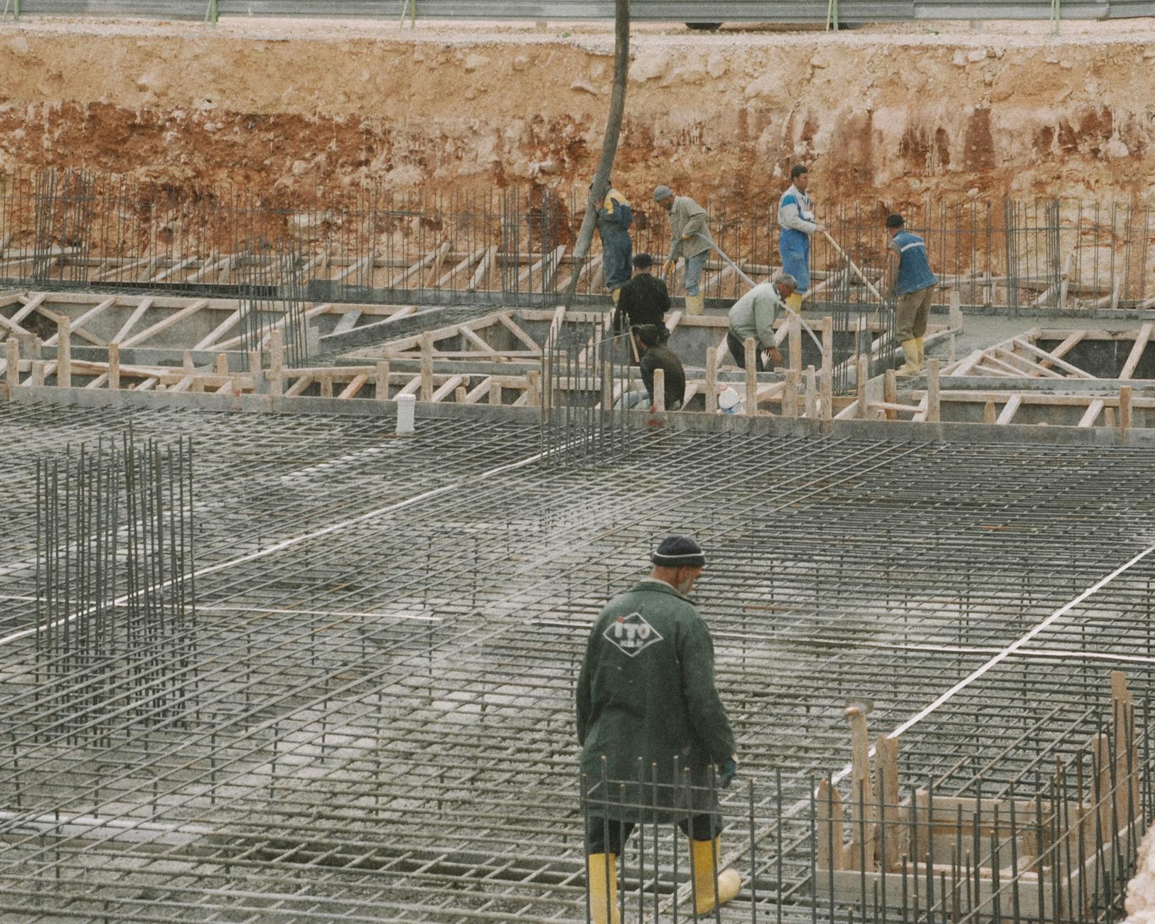 Concrete crew finishing a concrete slab on a Hoboken job site